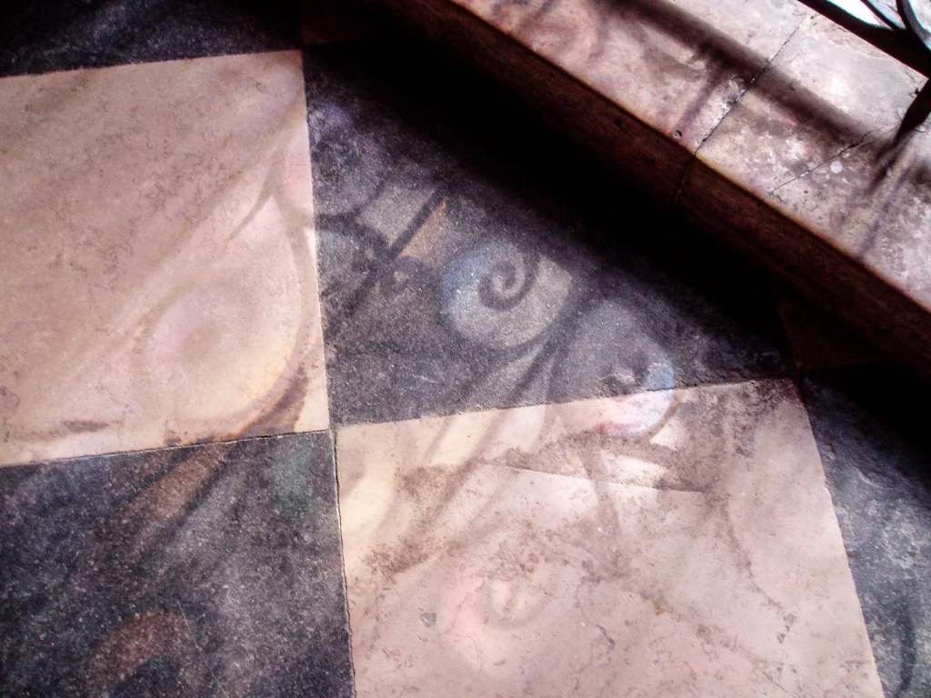 A 2003 photograph of the floor of Notre-Dame Cathedral. The fact that it’s filled with chromatic aberrations and JPEG artifacts from an early digital point-and-shoot matters little.